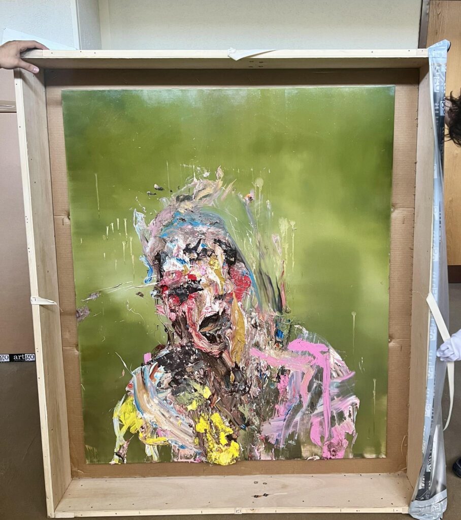 On-site inspection of a recently sourced artwork before professional storage